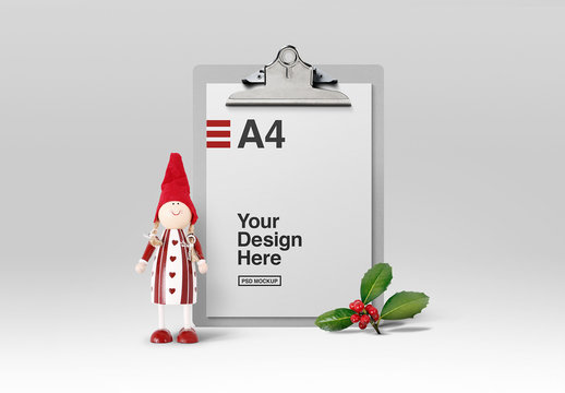 Stationery and Clipboard with Holly and Doll Decorations Mockup