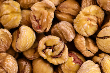 Closeup and background of many dried chestnuts as preserved dried fruits to eat