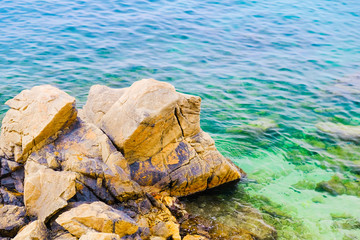 Beach of Mediterranean Sea with rocks in Lloret de Mar, Costa Brava.