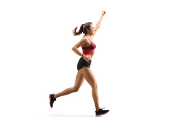 Fototapeta na wymiar Fit young woman in sportswear running and gesturing with hand