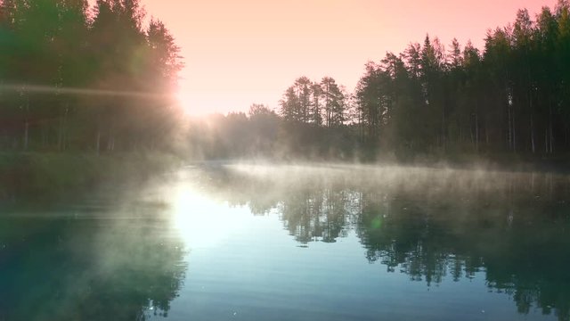 Morning on the river early morning reeds mist fog and water surface on the river. Mohko, Finland.
