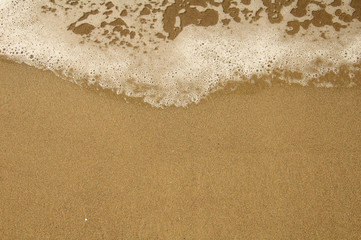 background texture sea wave on sand