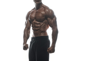 Obraz premium Fitness model man posing in studio