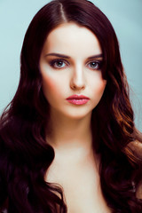 Fototapeta premium young pretty brunette woman with hairstyle waves, luxury look fashion makeup close up