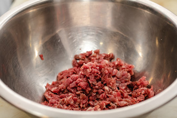 Chef preparing steak tartar of old cow sirloin with 40 days of maturation on restaurant