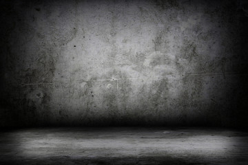 Grunge interior room with concrete wall and floor. Empty concrete space.