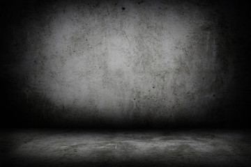 Grunge interior room with concrete wall and floor. Empty concrete space.