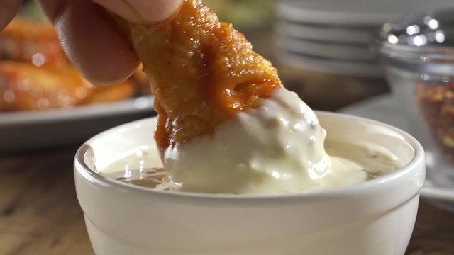 Delicious Buffalo style chicken wing dipped into ranch blue cheese sauce.
