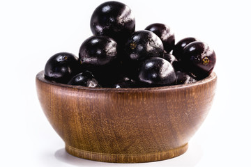 Jaboticaba in a basket on a white background