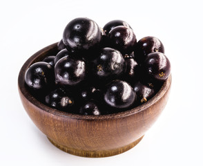 Jaboticaba in a basket on a white background. The jaboticaba or jabuticaba is a purplish black-white fruit, typical fruit of Brazil, Organic and healthy fruit without preservatives.