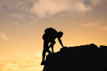 Determined man climbing up mountain.  Life goals, and inspiration concept. 