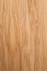 Naklejka premium Oak plank. The structure of natural oak. A tangential cut of a tree trunk. Brown natural background.