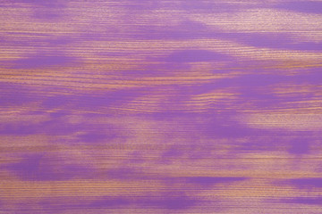 Wood panel painted in bright colors with aging effect. Wiped paint.