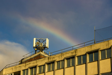 Fototapeta premium A rainbow over a phone mast