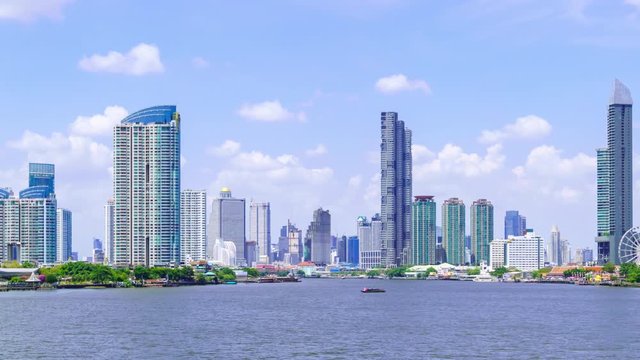 Time-lapse: Bangkok waterfront cityscape and Chao Phraya River during sunny day. Right aep.