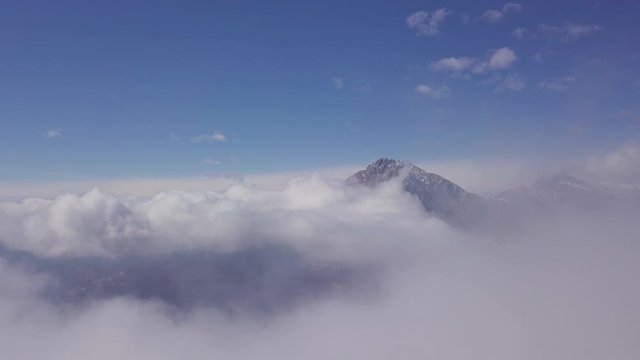 Grignetta summit above the clouds, Lecco, Lombardy, Italy