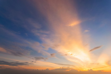Dramadic Sunset Sky blue and orange light of the sun through the clouds in the sky