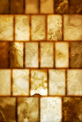 Onyx brick wall background. Texture of honey color onyx material