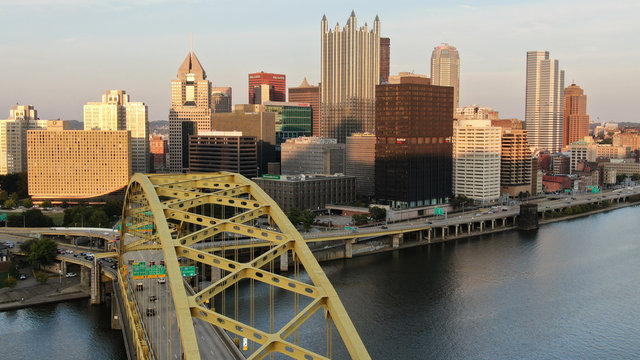 Pittsburgh's Skyline Rises Behind The Fort Pitt Bridge.