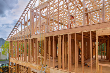Obraz premium Beam stick built frame of a new house under construction
