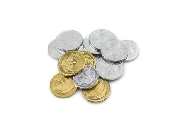 A macro image of a collection of silver and gold coins, shot close up in macro, from Nagorno-Karabakh against a clean, white background