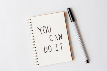 Written words you can do it on paper notebook with pen on white background.