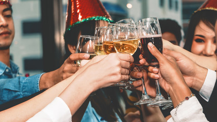 group of diversity businesspeople making toast together in corporate new year celebration party