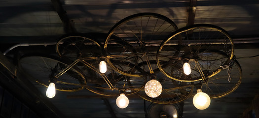 Hanging lamp made with bicycle wheels