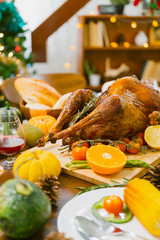 thanksgiving festive seasonal turkey homemade dinner with decorating items on wooden table holidays...