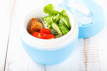 The baked chicken vegetables salad in a lunchbox. Healthy and fitness food. Diet. Selective focus. Copy space