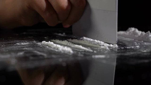 Strips of white cocaine powder on a table