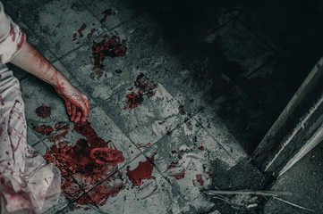 Girl zombie in the blood sitting smeared with blood  with resentment  torture and ask for help in abandoned building. Halloween murder concept. - obrazy, fototapety, plakaty