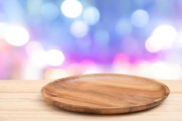 Empty wooden tray on perspective wooden table on top over blur background. Can be used mock up for...