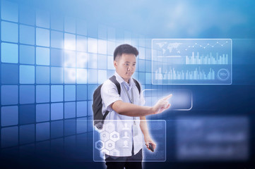 Teenage boy student in school uniform with backpack using holographic screen in advance technology concept 