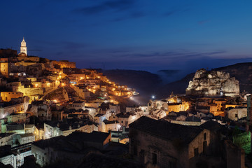 Obraz premium era, Townscape and historical cave dwelling, Sassi di Matera at blue hour