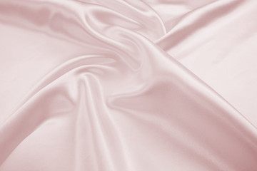 Naklejka premium Delicate satin draped fabric pink texture for festive backgrounds
