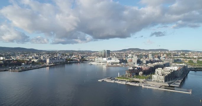 Cinema 4K drone shot with forward motion of the new Bj&oslash;rvika quarter, with the Lambda Munch Museum, Oslo Opera House and S&oslash;renga in clear daylight in autumn fall, in Oslo Norway.