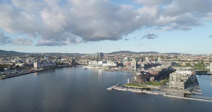 Cinema 4K drone shot with backward motion of the new Bj&oslash;rvika quarter, with the Lambda Munch Museum, Oslo Opera House and S&oslash;renga in clear daylight in autumn fall, in Oslo Norway.
