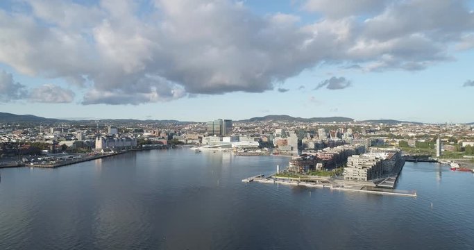 Cinema 4K drone shot with backward motion of the new Bj&oslash;rvika quarter, with the Lambda Munch Museum, Oslo Opera House and S&oslash;renga in clear daylight in autumn fall, in Oslo Norway.