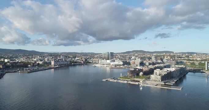 Cinema 4K drone shot with forward motion of the new Bj&oslash;rvika quarter, with the Lambda Munch Museum, Oslo Opera House and S&oslash;renga in clear daylight in autumn fall, in Oslo Norway.