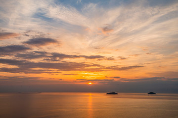 Natural Sunset Sunrise Over Field Or Meadow. Bright Dramatic Sky And Dark Ground. Countryside Landscape Under Scenic Colorful Sky At Sunset Dawn Sunrise. Sun Over Skyline, Horizon. Warm Colours.