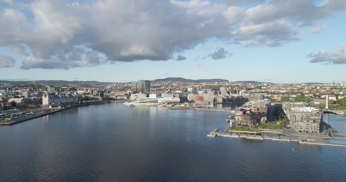 Cinema 4K drone shot with parallax motion of the new Bj&oslash;rvika quarter, with the Lambda Munch Museum, Oslo Opera House and S&oslash;renga in clear daylight in autumn fall, in Oslo Norway.