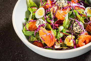 salad with salmon and quail eggs