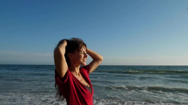 Attractive woman walking along the beach in Southern California