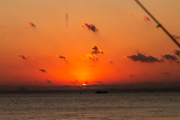 Romantic Natural Sunset Sunrise Over Field Or Meadow. Bright Dramatic Sky And Dark Ground. Countryside Landscape Under Scenic Colorful Sky At Sunset Dawn Sunrise. Sun Over Skyline, Horizon