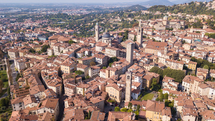 Fototapeta na wymiar Bergamo, Italy. Amazing drone aerial view of the old town. Landscape at the city center, Its historical buildings and the towers