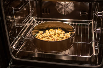 baking tray with granola in the oven