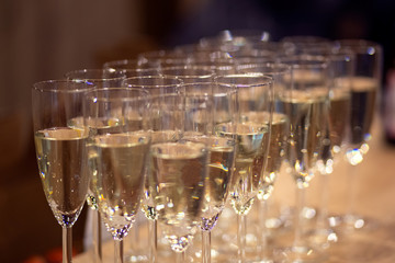 champagne poured into glasses at the party