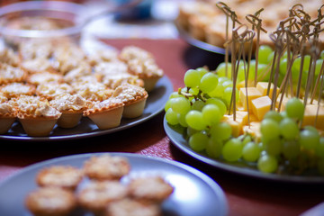 snacks grapes, cheese, tartlets at the party