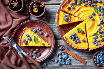 close-up of pumpkin pie and mulled wine in cups